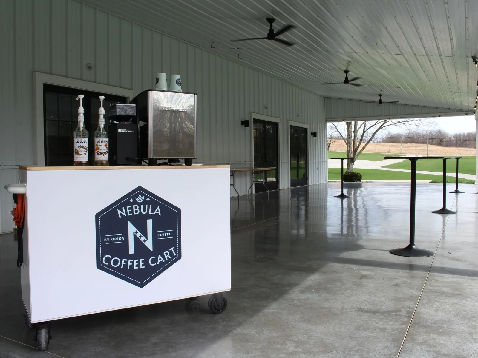 Barista crafting specialty drinks at corporate event