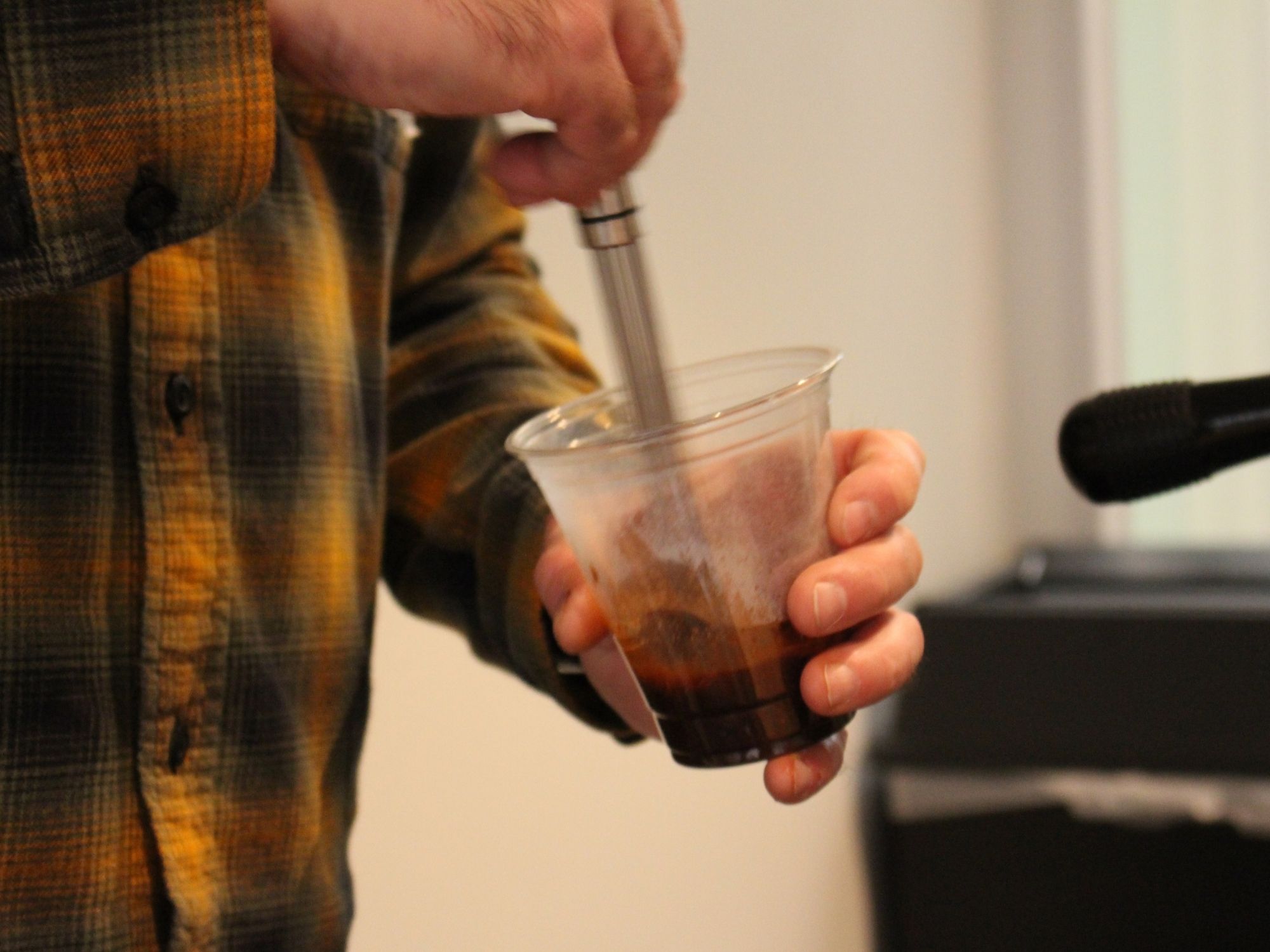 Iced coffee preparation at mobile catering event